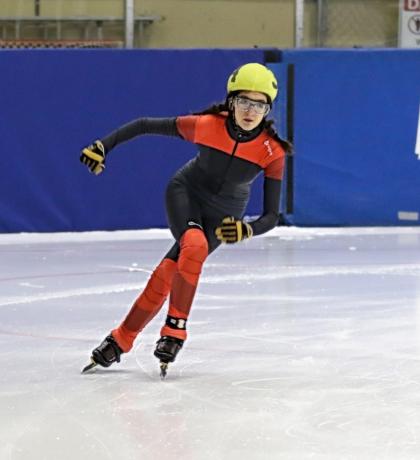 Hillary Birkett speed skating on the ice