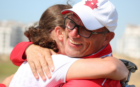 SO Team Canada 2019 coach Glenn Cundari hugs one of his athletes.