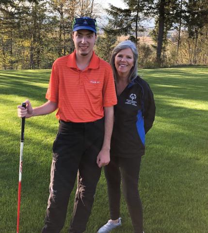 Jayne Burton poses with her son for a photo on a golf course