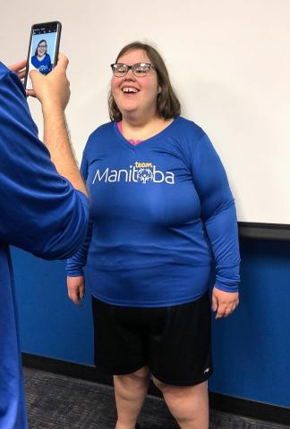 Christine Hoffman poses as her photo is taken for SO Team Manitoba.