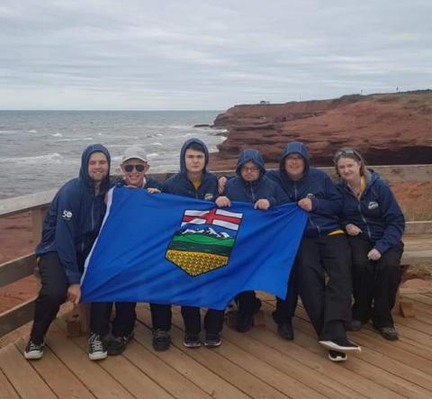 a group of people holding a flag