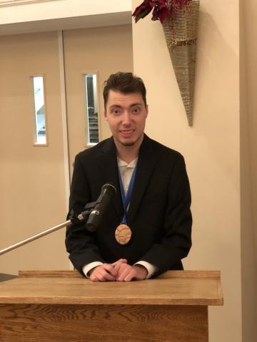 Christian Burton delivering a speech to Manulife