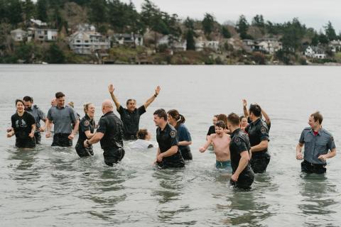 Plungers cheering with each other in cold waters