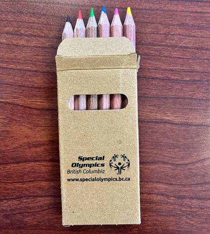 Six mini pencil crayons in different colours in a box with the SOBC logo and website address