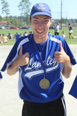 SOBC - Langley softball athlete Christian smiling with his medal
