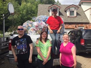 SOBC - Terrace athletes posing in front of a pickup truck with bags of recycled bottles in the background
