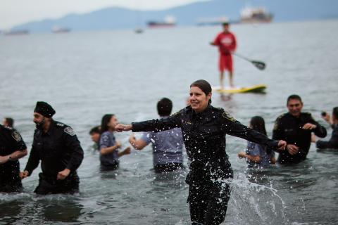VPD members smiling and running out of chilly waters