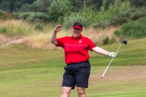 Erin Thom celebrating on golf course