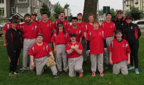 SOBC Abbotsford's C division softball team posing and smiling in a group photo