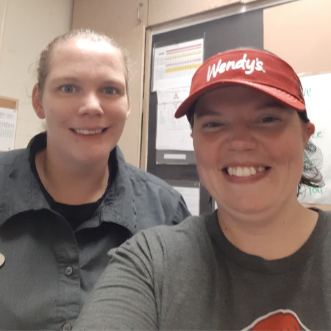 Sarah and Crystal pose for a selfie at work