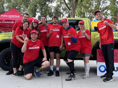 motionball Marathon of Sport Kelowna participants group photo in front of truck