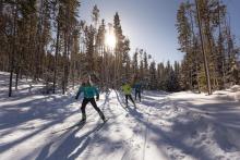 Two people cross country skiing at Stave Lake Trails